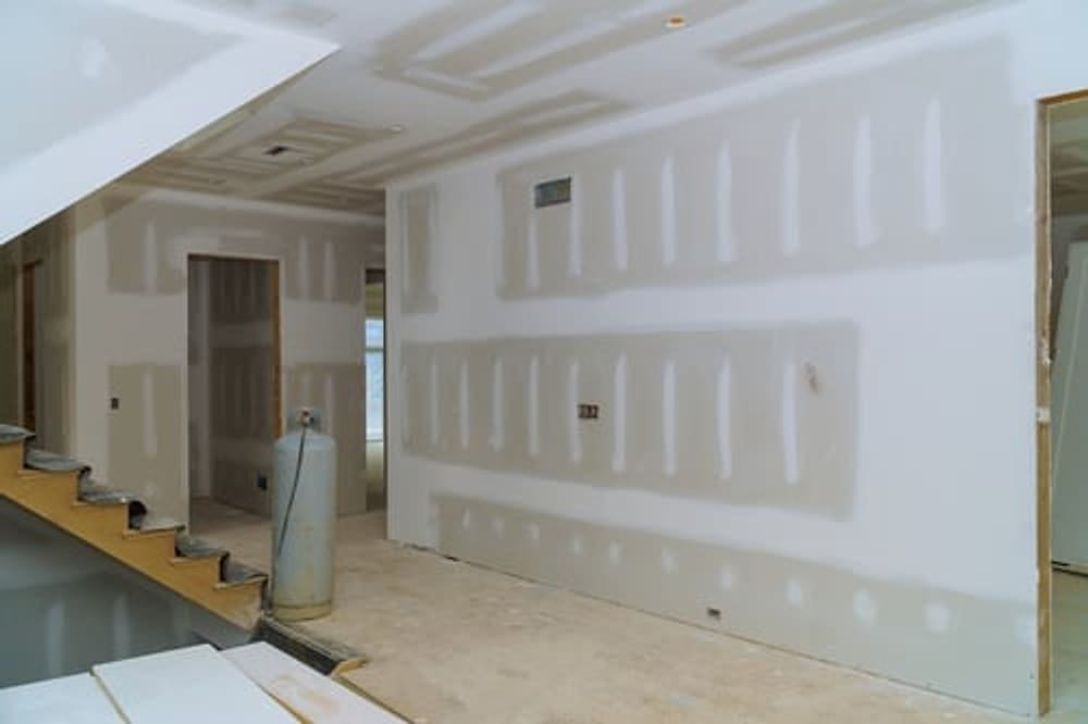 Hung and taped drywall in a residential interior finished by G&I B Construction