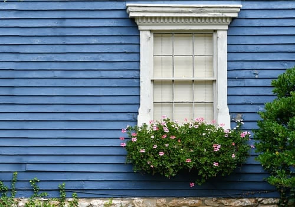 Blue lap siding with white trim on a home re-sided by G&I B Construction in Southern Indiana