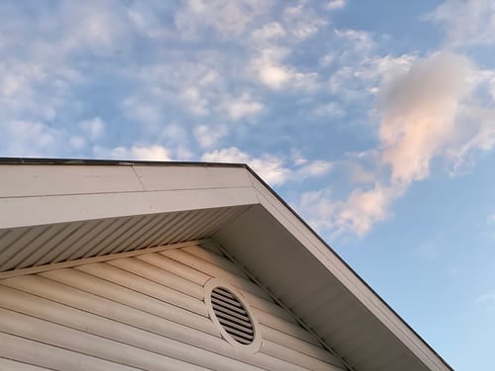 Clean vented soffit and fascia along a roof eave installed by G&I B Construction